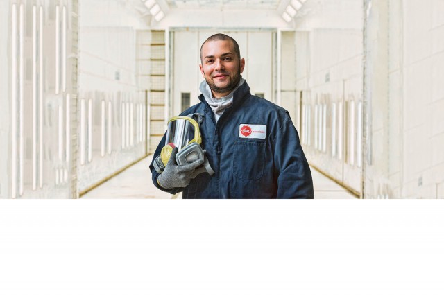 Team Industries Employee in a paint booth